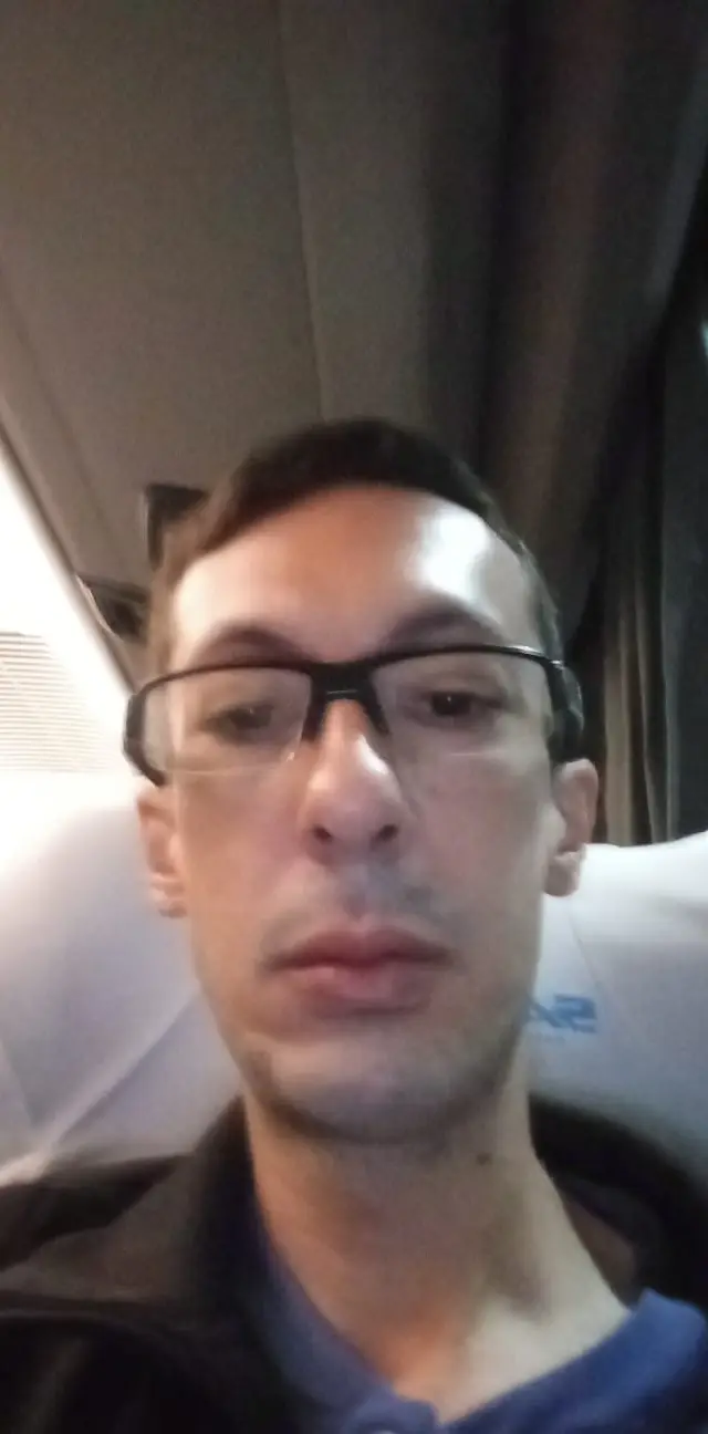 Peregrino a bordo do ônibus, no início da viagem rumo a Aparecida